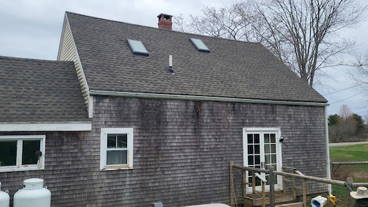 How do ice dams damage roofs